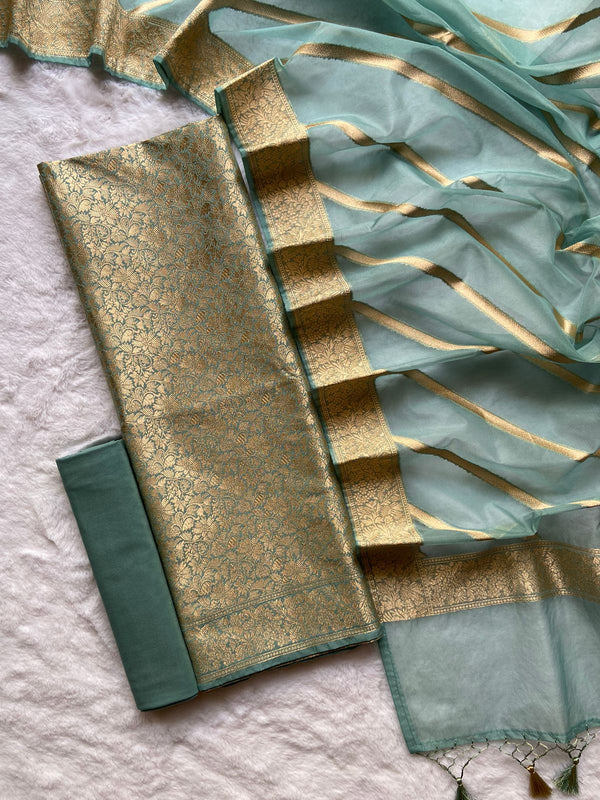 Pure Banarasi Brocade Weaved Jaal Unstsiched Suit With Organza Zari Work Dupatta.